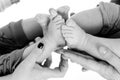 Baby Twins Feet in parents hands Royalty Free Stock Photo