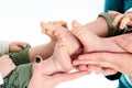 Baby Twins Feet in parents hands Royalty Free Stock Photo