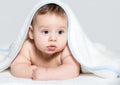 Baby under white towel Royalty Free Stock Photo