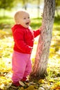 Baby walk under trees in park