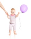 Baby walking with balloon closeup portrait