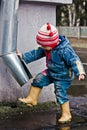 Baby washes the feet of a drain pipe. Royalty Free Stock Photo