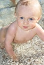 Baby in water on beach