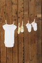 Baby wear hanging in clothespins on washing line