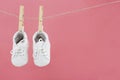 Baby wear hanging in clothespins on washing line Royalty Free Stock Photo