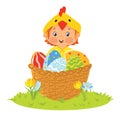 Baby wearing chick costume in a basket with eggs Royalty Free Stock Photo