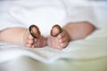 Baby wearing wedding rings on big toes Royalty Free Stock Photo