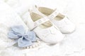 Baby white baptism or birthday dress and shoes close up with spa