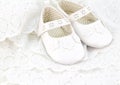 Baby white baptism or birthday dress and shoes close up with spa