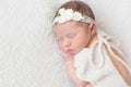 Baby with white hairband, dressed in suit