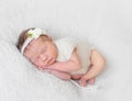 Baby with white hairband, dressed in suit Royalty Free Stock Photo