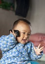 The baby whom that cellular phone makes a phone call Royalty Free Stock Photo