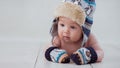 Baby in winter hat and mittens lying Royalty Free Stock Photo