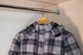 Baby winter jacket on the hanger,The house hangs in the closet of the boy`s winter jacket Royalty Free Stock Photo