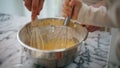 Baby woman hands mixing ingredients bowl indoors closeup. Unknown family cooking Royalty Free Stock Photo