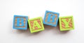 Baby word made from colourful wooden baby development blocks