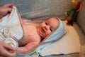 Baby wrapped in a towel after bathing Royalty Free Stock Photo