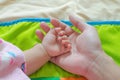 The baby& x27;s hand rests on his father& x27;s hand. Feel the warmth Royalty Free Stock Photo