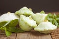 Baby Zucchini. Little zzuchini in flower shape with basil leaves over rustic wooden Background. Organic healthy vegetables and foo Royalty Free Stock Photo