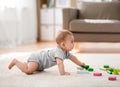 Asian baby boy playing with toy blocks at home Royalty Free Stock Photo