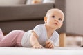 little baby girl crawling on floor at home Royalty Free Stock Photo