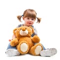 Babyr girl hugging a teddy bear