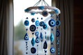 a babys crib mobile with evil eye charms dangling Royalty Free Stock Photo