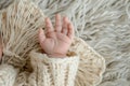 babys hand inside a handknit mitten Royalty Free Stock Photo