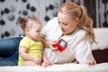 Babysitter and baby playing with toy cubes at home Royalty Free Stock Photo