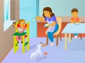 Babysitter feeding baby in the kitchen Royalty Free Stock Photo