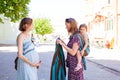 Babywearing consultant meets pregnant lady outdoor in park