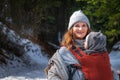 Babywearing mother winter travel with copy space