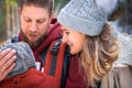 Babywearing winter walk of young parents with their children outdoor Royalty Free Stock Photo