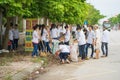 Bac Ninh, Vietnam - Sep 9, 2015: Group of high school students cleaning street in front of their school within the volunteer event