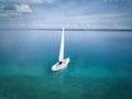 BACALAR, MEXICO, 07 OCTOBER 2017: White sailing boat in the lagoon - shot from drone