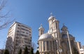 The orthodox church of the Holy Martyr Dimitrie against a bright blue sky, in Bacau, Romania