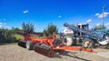 Bacau, Romania - September 12, 2022: Large disc plough Phenix, towing for tractors to plow fields and EVRARD irrigation