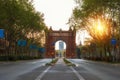 Bacelona Arc de Triomf during sunrise in the city of Barcelona in Catalonia, Spain. The arch is built in reddish brickwork in the