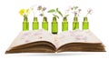 Bach flower remedies, phytotherapy - bottle and old book Royalty Free Stock Photo
