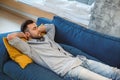 Bachelor man daily routine in the living room single lifestyle concept having nap Royalty Free Stock Photo