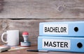 Bachelor and Master. Two binders on desk in the office. Business Royalty Free Stock Photo