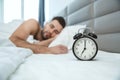 Bachelor man daily routine single lifestyle morning concept alarm clock