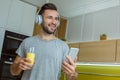 Bachelor man daily routine in the kitchen single lifestyle concept listening to music Royalty Free Stock Photo