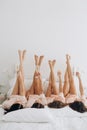 Bachelorette party bed lying legs champagne glasses