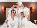 Bachelorette party fun females bathrobes champagne Royalty Free Stock Photo