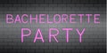 Bachelorette party hot pink realistic neon sign on brick wall background. Wedding planning and preparation. Hens party decoration