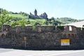 Bachrach, Germany - 09 05 2023: City walls at the main road with vineyards and Burg Stahleck above Royalty Free Stock Photo