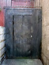 Back alley metal door. Royalty Free Stock Photo