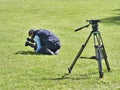 Back angle view of high definition digital video camera which recording or shooting tv commercial production. Camera man sitting