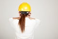 Back of Asian Engineer girl with hard hat got headache Royalty Free Stock Photo